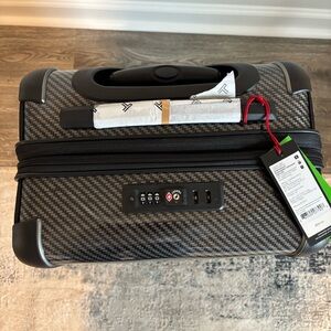 Tumi brand new with tags Nov 2024 international expandable 4 wheeled carry-on